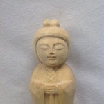 Load image into Gallery viewer, Closeup face and hands with lotus of 5 inch tall light colored wood hand carved statue of a Japanese Kuan Yin, knows as Kannon, holding a lotus.
