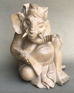 Load image into Gallery viewer, Genesha statue seated reading  lontar 5 inches tall, hand-carved from light colored wood.
