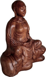 Load image into Gallery viewer, Wooden sculpture of a Buddhist nun seated in meditation.
