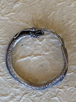 Load image into Gallery viewer, Dragon bracelet with dragons head and tail and interesting detailing
