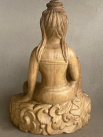 Load image into Gallery viewer, Back of Wooden statue of a seated Quan Yin  on a decorative base against a plain background
