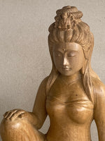 Load image into Gallery viewer, Close up of Wooden sculpture of a seated Quan Yin  on a plain background
