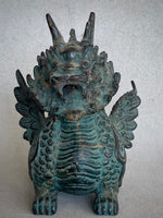 Load image into Gallery viewer, A detailed Japanese and Chineses mythological creature with wings and scale horns and with a green patina, standing on a light gray textured background front view.
