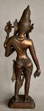 Load image into Gallery viewer, Back view Bronze statue of a standing Dewi Tara with intricate details on a neutral background back view
