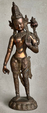 Load image into Gallery viewer, Front view of Bronze statue Standing Dewi Tara, one hand down the other holding a lotus on a gray background
