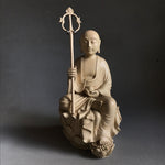 Load image into Gallery viewer, Hand carved light wood statue of Jizo Bodhisattva seated on a lotus staff in one hand and wish fulfilling gem in the other
