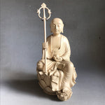 Load image into Gallery viewer, Hand carved light wood statue of Jizo Bodhisattva seated on a lotus staff in one hand and wish fulfilling gem in the other
