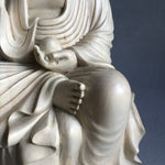 Load image into Gallery viewer, Hand carved light wood statue of Jizo Bodhisattva seated on a lotus staff in one hand and wish fulfilling gem in the other detail of hand with wish fulfilling gem and foot
