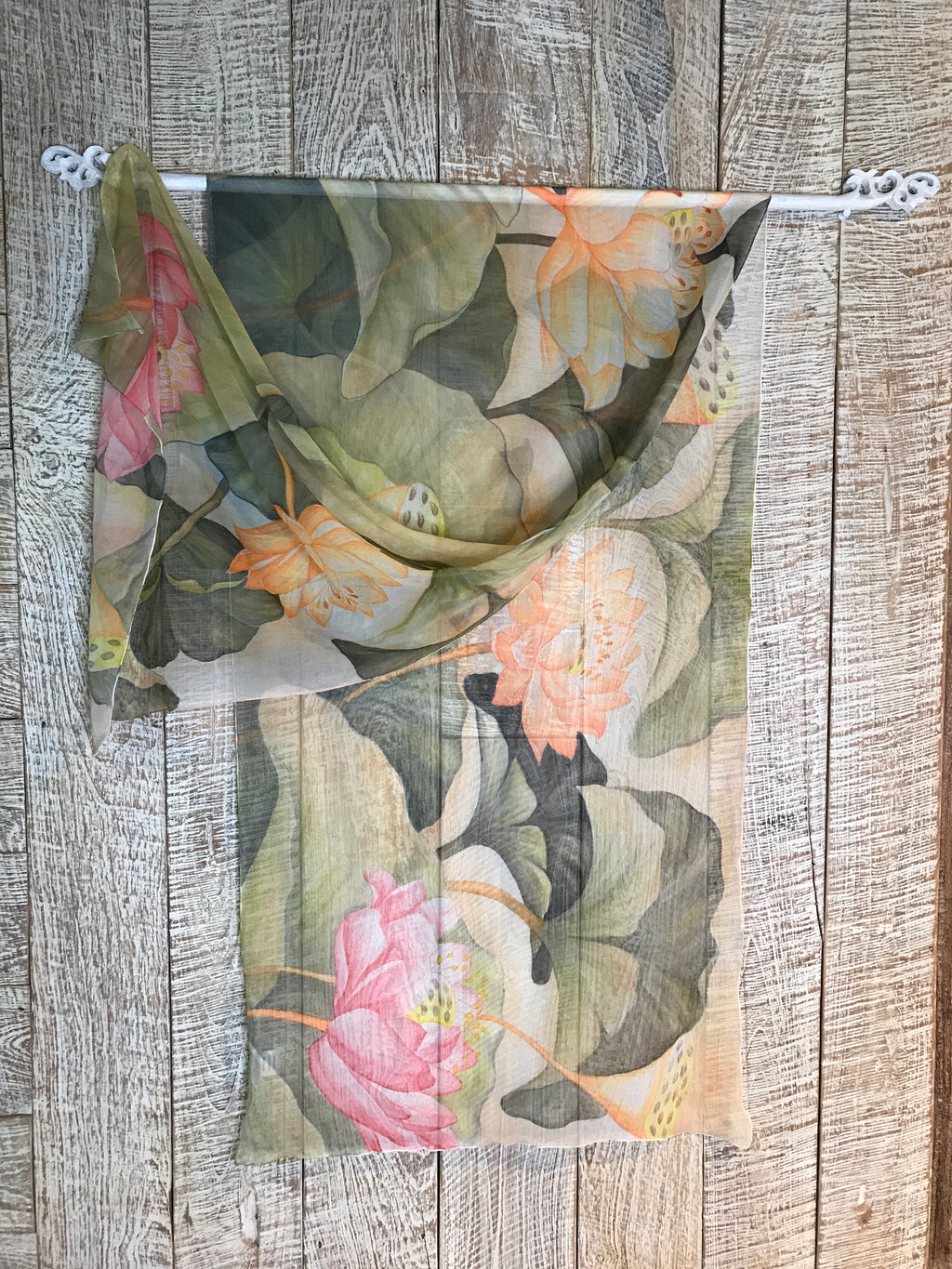 Hand Painted lotus on silk chiffon scarf in pastel greens, soft oranges and pinks on see through silk.