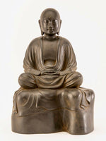 Load image into Gallery viewer, Jizo in Meditation serenely seated on a rock rust brown
