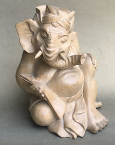 Genesha statue seated reading  lontar 5 inches tall, hand-carved from light colored wood.