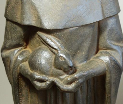 Saint Francis of Assisi Statue, Antique Rust 32 inches closeup of hands holding a baby rabbit