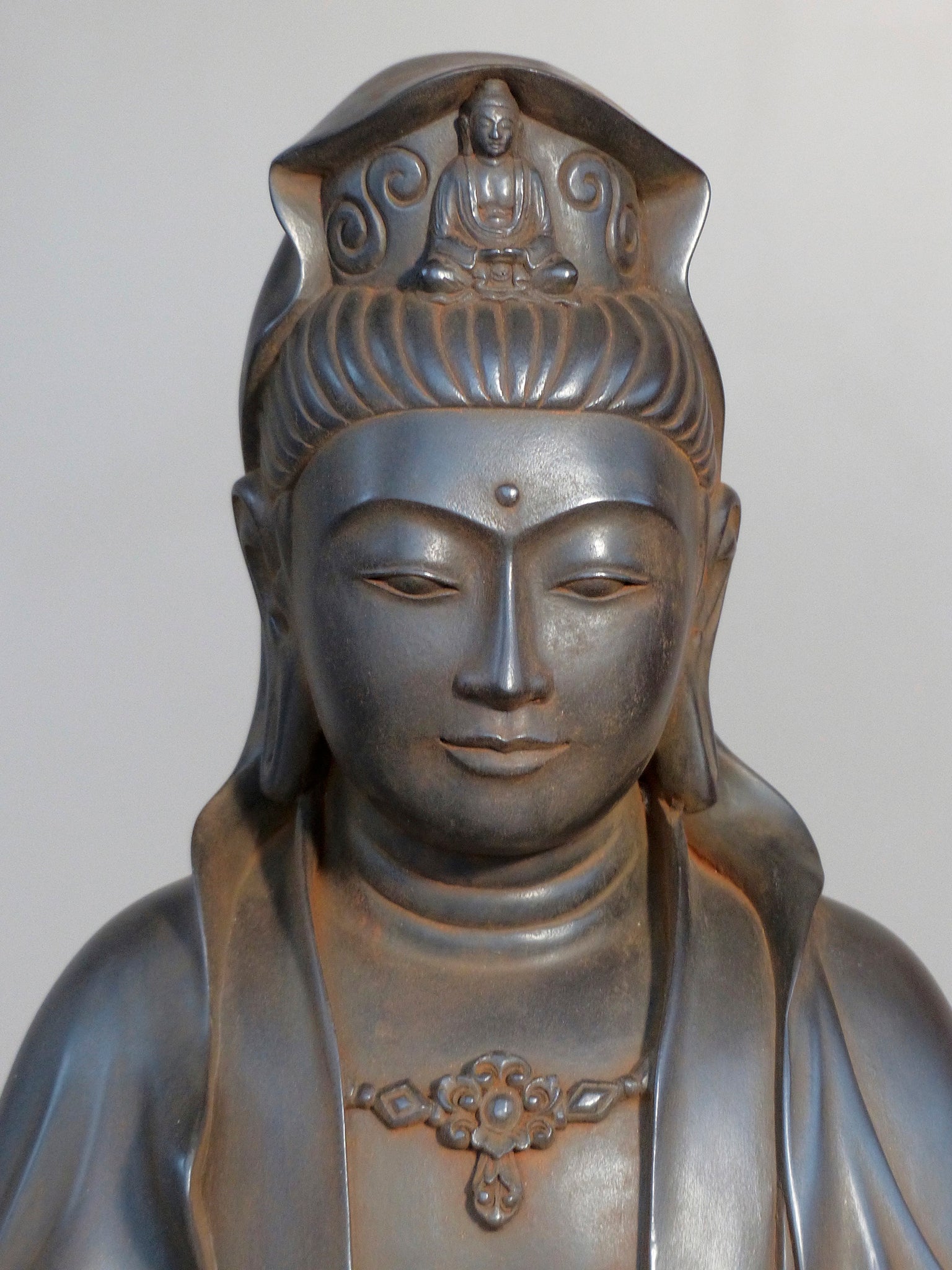 Quan Yin statue seated antique rust 24 inches close up of her beatuiful young serine face
