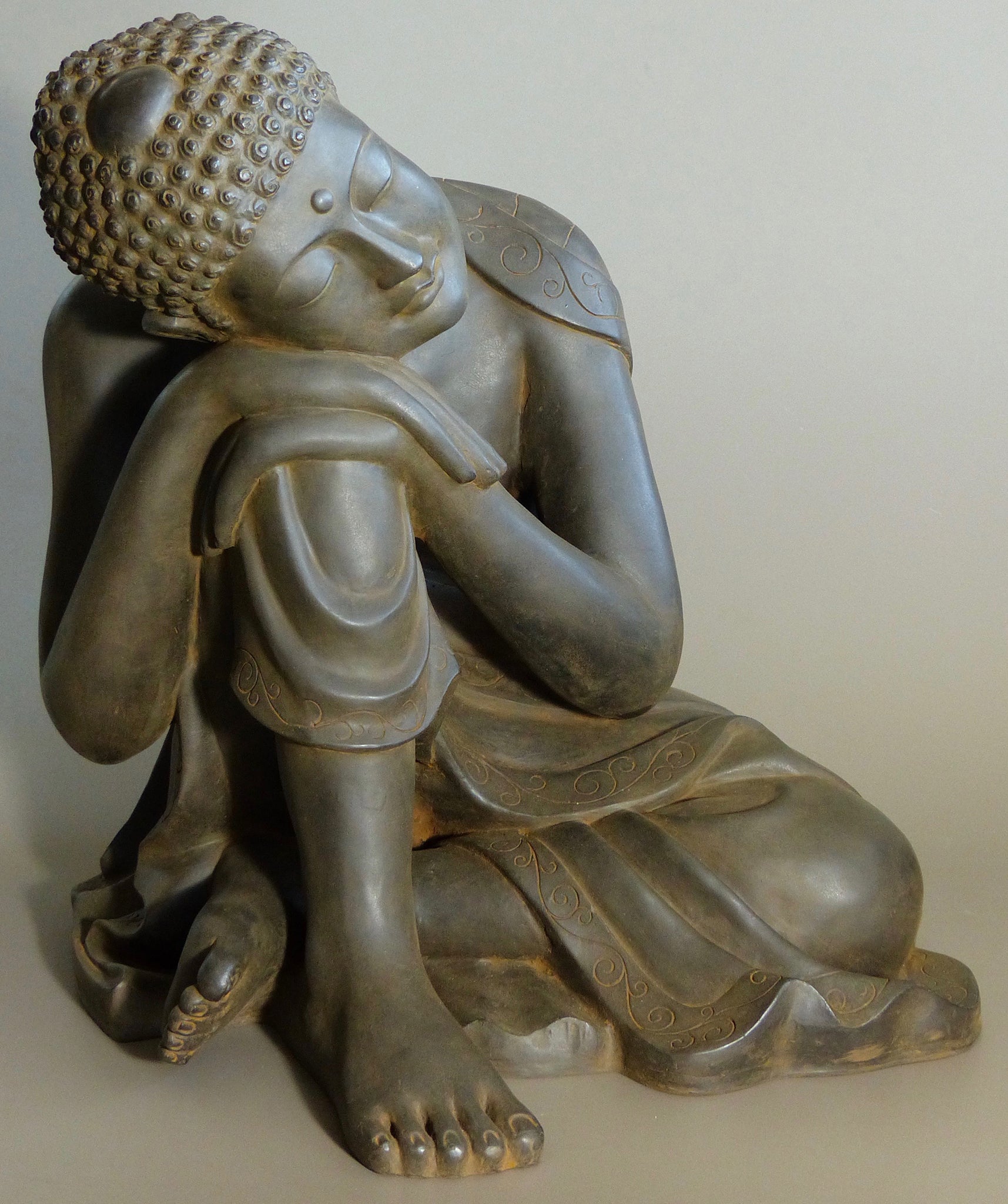 Resting Buddha Antique Rust 24 inches veiw from left